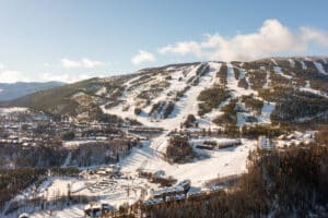 Distance shot of Kimberley Alpine Resort's ski runs on a sunny day.