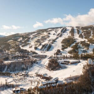 Distance shot of Kimberley Alpine Resort's ski runs on a sunny day.