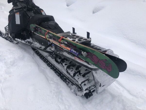 Close up image of how skis are attached to the aluminum/stainless steel sled rack.