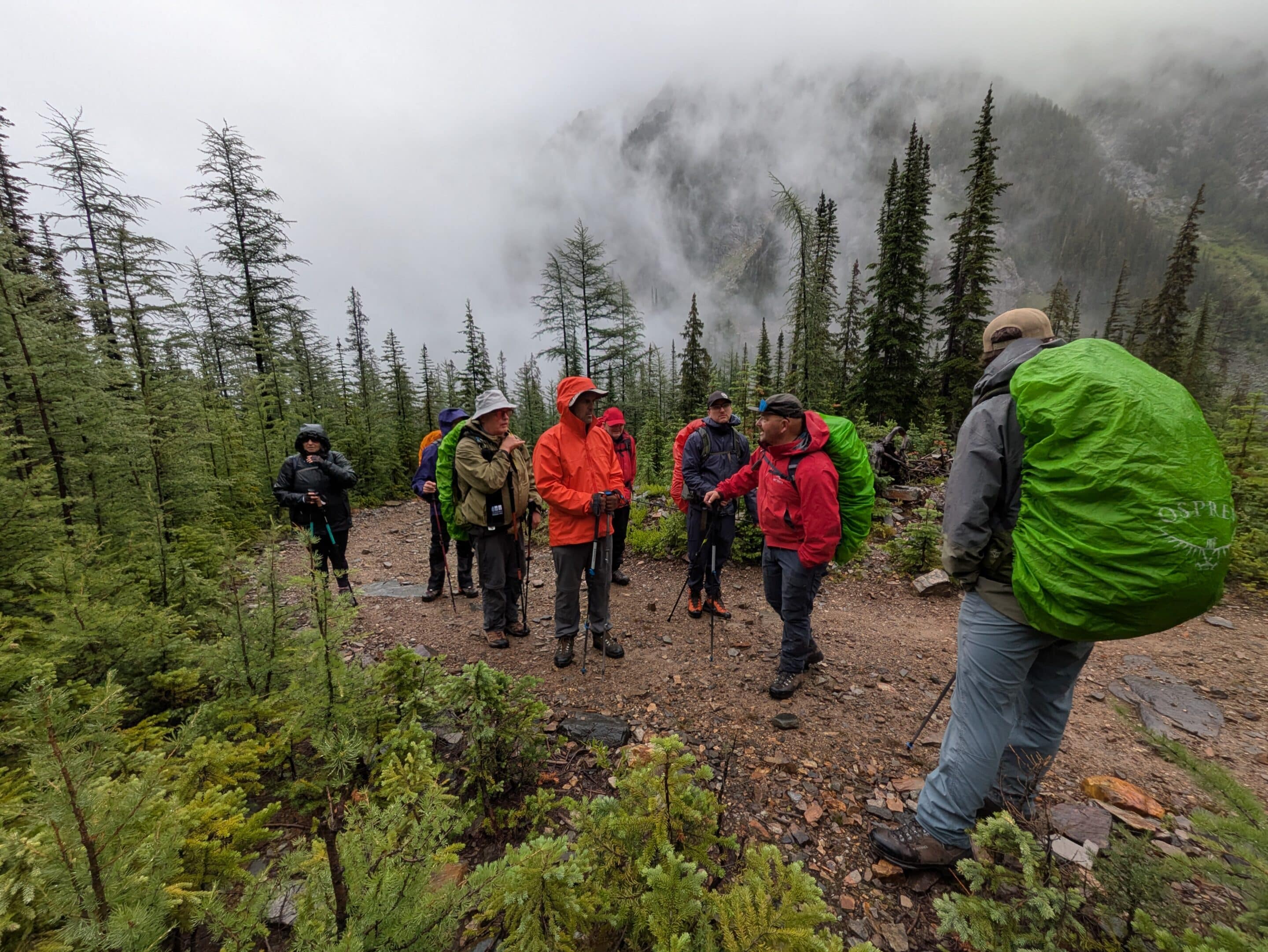 Five participants form a line on their knees as they practice shovelling techniques during a companion rescue practice.